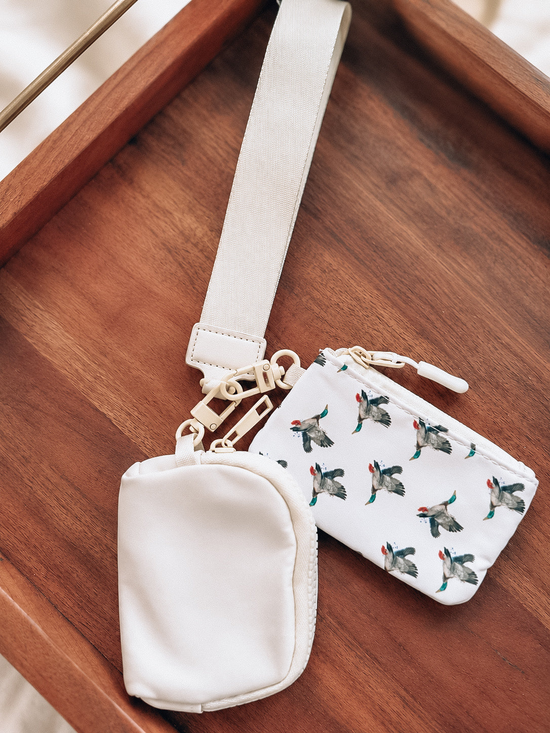 The cream mallard wristlet